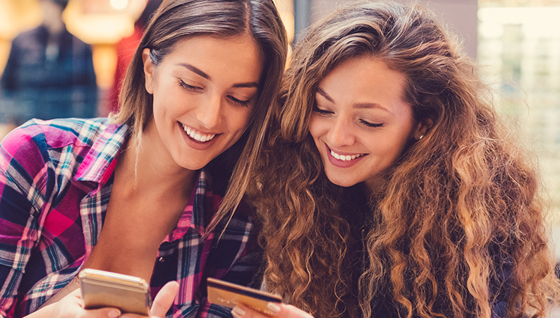 Two women using smartphone