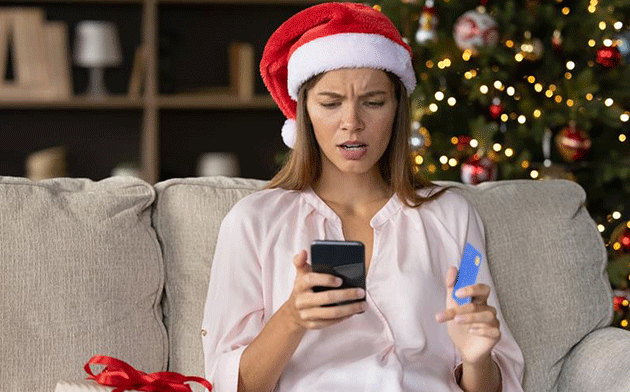 Concerned woman in Santa hat