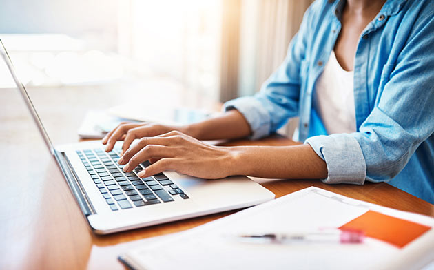 Woman typing on laptop