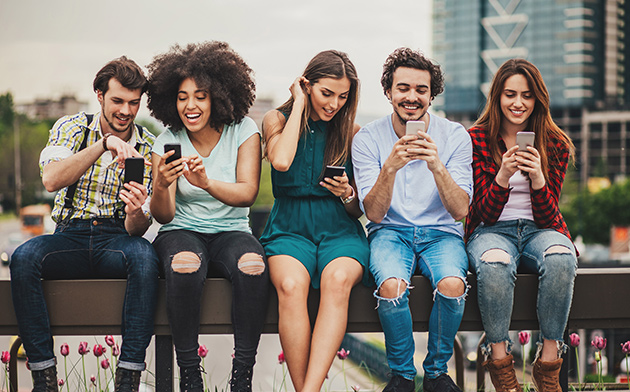 Young people looking at their phones