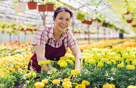 Woman sitting outside gardening
