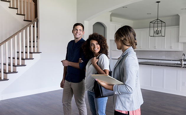 Young couple looking at purchasing a new home